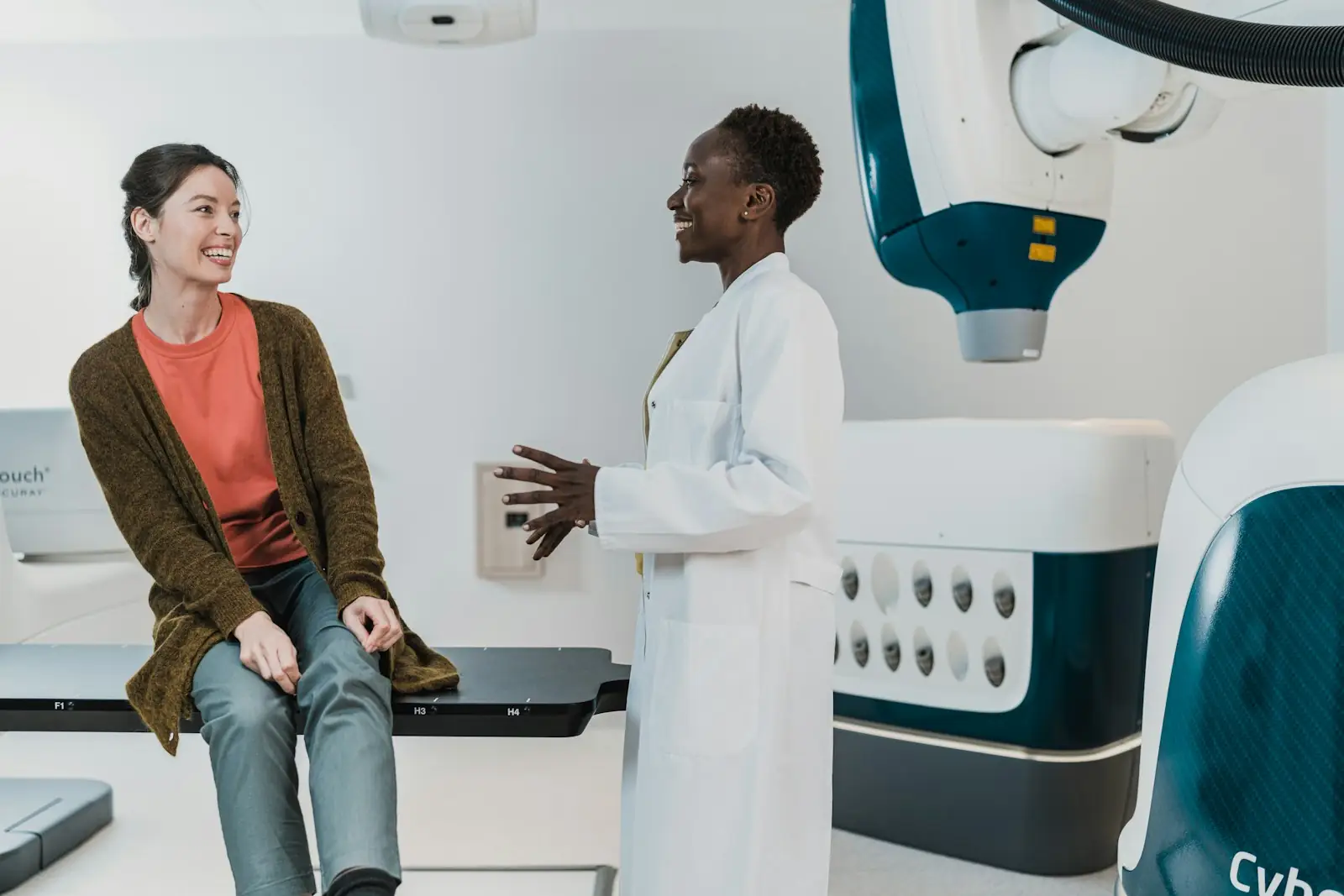A doctor talking to a patient in an exam room